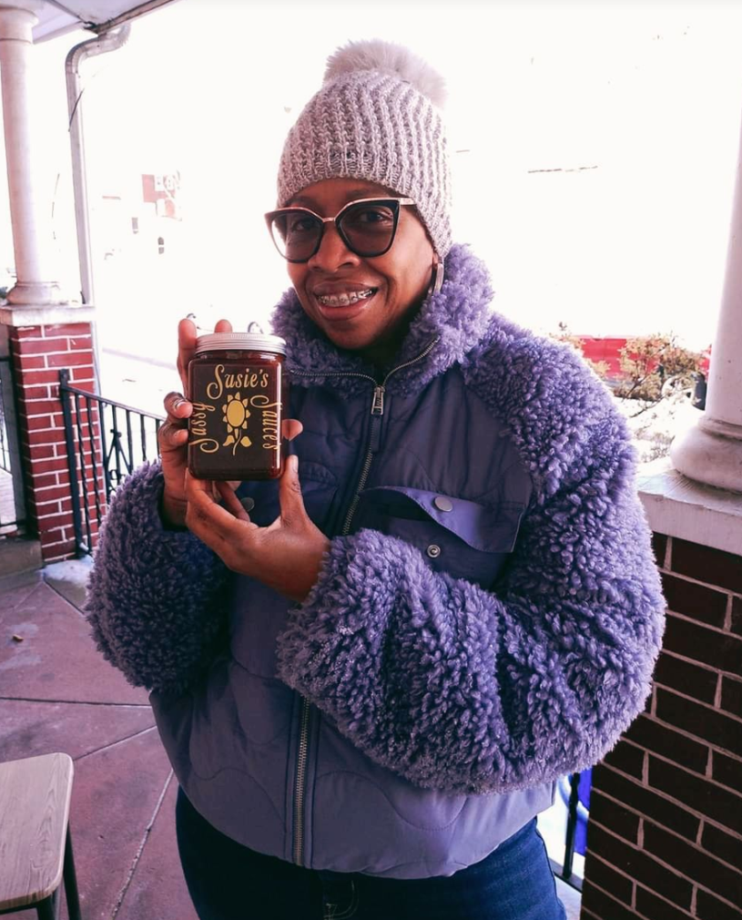 Customer holding Sassy Susie's flask